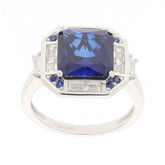 Elegant blue sapphire sterling silver ring with accent stones, featuring a stunning round cut gemstone.